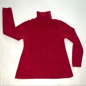 Cranberry red maternity turtleneck sweater.